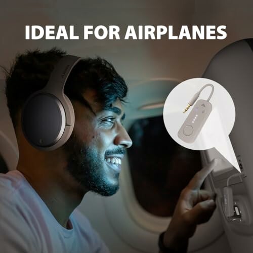 Man using headphones with airplane adapter