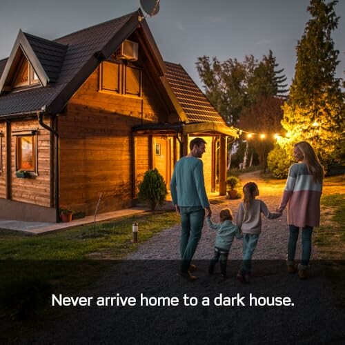 Family arriving at a warmly lit house at dusk.