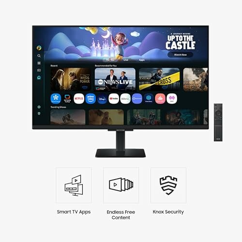Smart TV showing apps and features with remote control.